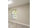 Bedroom featuring wood-look floors, a window and neutral paint at 2028 Donegan Pl, Orlando, FL 32826