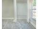 Bedroom closet with a window and wood-look floors at 2028 Donegan Pl, Orlando, FL 32826