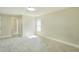 Bedroom features gray flooring, natural lighting, with an ensuite bathroom and closet at 2028 Donegan Pl, Orlando, FL 32826