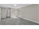 A light-filled bedroom with wood-look floors, fresh paint, and a single window at 2028 Donegan Pl, Orlando, FL 32826