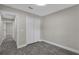 This bedroom features neutral paint, a closet, and wood-look flooring at 2028 Donegan Pl, Orlando, FL 32826