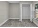 This bedroom features a closet with shelving and wood-look floors at 2028 Donegan Pl, Orlando, FL 32826