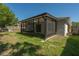 Exterior view of the enclosed lanai and back yard at 2028 Donegan Pl, Orlando, FL 32826