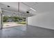 Clean garage with epoxy flooring and ample space for parking and storage at 2028 Donegan Pl, Orlando, FL 32826