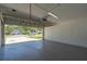Garage featuring an open garage door at 2028 Donegan Pl, Orlando, FL 32826