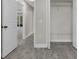 A view down the hallway reveals wood-look flooring and white trim at 2028 Donegan Pl, Orlando, FL 32826