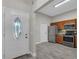 Open kitchen with stainless steel appliances, granite countertops, and wood-look tile flooring at 2028 Donegan Pl, Orlando, FL 32826