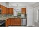 Updated kitchen with granite countertops, stainless steel appliances, and ample cabinet space at 2028 Donegan Pl, Orlando, FL 32826