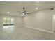 Bright living room with tile flooring, recessed lighting, and sliding doors to the outside at 2028 Donegan Pl, Orlando, FL 32826