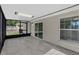 This screen patio has backyard access and neutral tile flooring at 2028 Donegan Pl, Orlando, FL 32826