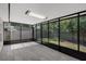 Screened patio overlooking the yard featuring light, neutral tile at 2028 Donegan Pl, Orlando, FL 32826