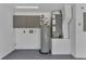 The utility room features storage cabinets, water heater, and HVAC system at 2028 Donegan Pl, Orlando, FL 32826