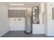 Utility room featuring water heater, HVAC, and storage at 2028 Donegan Pl, Orlando, FL 32826