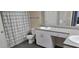 This bathroom includes dual sinks, granite countertops, and a shower with a shower curtain at 204 E South St # 4056, Orlando, FL 32801