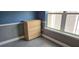 This bedroom features attractive herringbone floors, light-colored baseboards, and a new, light-colored dresser at 204 E South St # 4056, Orlando, FL 32801