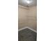 This closet features attractive herringbone floors, light-colored baseboards, and built-in shelving at 204 E South St # 4056, Orlando, FL 32801