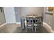 Dining room with gray wood style table and four chairs at 204 E South St # 4056, Orlando, FL 32801