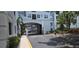 Gated entry featuring mature palm trees and black iron fencing at 204 E South St # 4056, Orlando, FL 32801