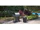 Outdoor stainless steel grill in a lushly landscaped community area near the pool at 204 E South St # 4056, Orlando, FL 32801