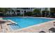 This beautiful pool includes a ramp with a chrome railing to make entering and exiting the pool easier at 204 E South St # 4056, Orlando, FL 32801