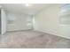 Spacious carpeted bedroom featuring ample natural light from multiple windows, with sliding door access at 2061 Rush Bay Way, Orlando, FL 32824