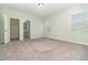 Carpeted bedroom features natural light, ensuite bathroom, and walk-in closet at 2061 Rush Bay Way, Orlando, FL 32824