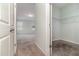 View of a bedroom featuring neutral carpeting, light walls, and a walk-in closet at 2061 Rush Bay Way, Orlando, FL 32824
