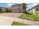 Charming home featuring a two-car garage and well-maintained lawn at 2061 Rush Bay Way, Orlando, FL 32824