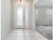 Inviting foyer with tile flooring and a modern front door at 2061 Rush Bay Way, Orlando, FL 32824