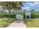 A well-maintained community tennis court with new green fence and court rules sign at 2061 Rush Bay Way, Orlando, FL 32824