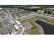 Townhouses near a pond and golf course; a great location with lots of parking and landscaping at 2450 Sweet Viburnum Way, Ocoee, FL 34761