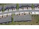 A nice aerial view of the community streets, landscaping, and parking in front of each townhouse at 2450 Sweet Viburnum Way, Ocoee, FL 34761
