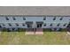 A beautiful backyard shared by attached townhouses with a patio and air conditioning units at 2450 Sweet Viburnum Way, Ocoee, FL 34761