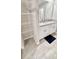 Bathroom featuring double sink vanity with granite countertop and ample storage, complimented by tile flooring at 2450 Sweet Viburnum Way, Ocoee, FL 34761