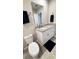Well-lit bathroom with granite countertops, stylish fixtures, and tile flooring at 2450 Sweet Viburnum Way, Ocoee, FL 34761