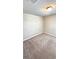 This bedroom features neutral walls, plush carpet, and an overhead light fixture at 2450 Sweet Viburnum Way, Ocoee, FL 34761