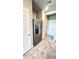 Hallway with stainless steel refrigerator with ice maker at 2450 Sweet Viburnum Way, Ocoee, FL 34761