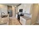 Modern kitchen featuring granite countertops, stainless steel appliances, and sleek white cabinets at 2450 Sweet Viburnum Way, Ocoee, FL 34761