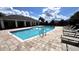 Community pool with a covered seating area and plenty of lounge chairs at 2450 Sweet Viburnum Way, Ocoee, FL 34761