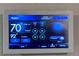 Digital thermostat displaying indoor and outdoor temperature, time, and humidity at 2450 Sweet Viburnum Way, Ocoee, FL 34761