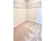 This walk-in closet features carpeted floors and wire shelving at 2450 Sweet Viburnum Way, Ocoee, FL 34761