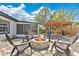 Cozy backyard with a stone fire pit and covered grill deck, great for entertaining at 2460 Worthington Rd, Maitland, FL 32751