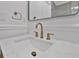 Bathroom sink with brass faucet and a white marble countertop at 2460 Worthington Rd, Maitland, FL 32751