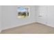 A cozy bedroom featuring hardwood floors, a window, and an ample closet at 2460 Worthington Rd, Maitland, FL 32751