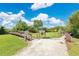 Community park entrance with a wooden boardwalk, signage, and lush greenery at 2460 Worthington Rd, Maitland, FL 32751