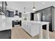 Open kitchen with a center island, stainless steel appliances, and dark cabinets at 2460 Worthington Rd, Maitland, FL 32751