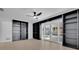 Large living room with custom built-ins and french doors at 2460 Worthington Rd, Maitland, FL 32751