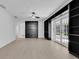 Spacious living room with custom built-ins and french doors at 2460 Worthington Rd, Maitland, FL 32751