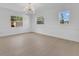 Bright living room with many windows and newly refinished hardwood floors at 2460 Worthington Rd, Maitland, FL 32751