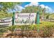 Kewannee Park signage featuring green pillars, decorative foliage and a ladybug at 2460 Worthington Rd, Maitland, FL 32751